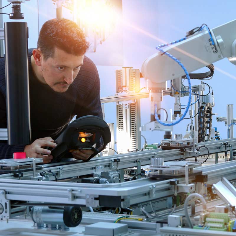 welder working with machinery